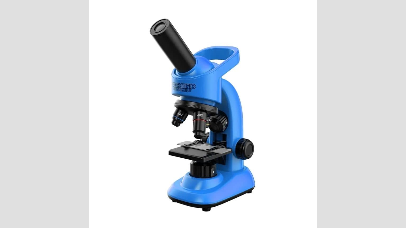 Microscopio monocular Novystor con oculares intercambiables y muestras preparadas sobre mesa de trabajo