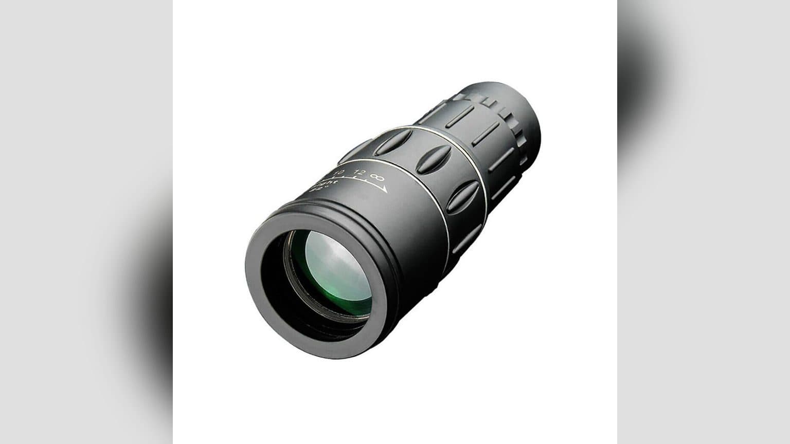 Monocular DSTARGAZE 16x52mm sobre una mano, mostrando su tamaño compacto de 150mm junto al mini morral de transporte y la correa incluidos