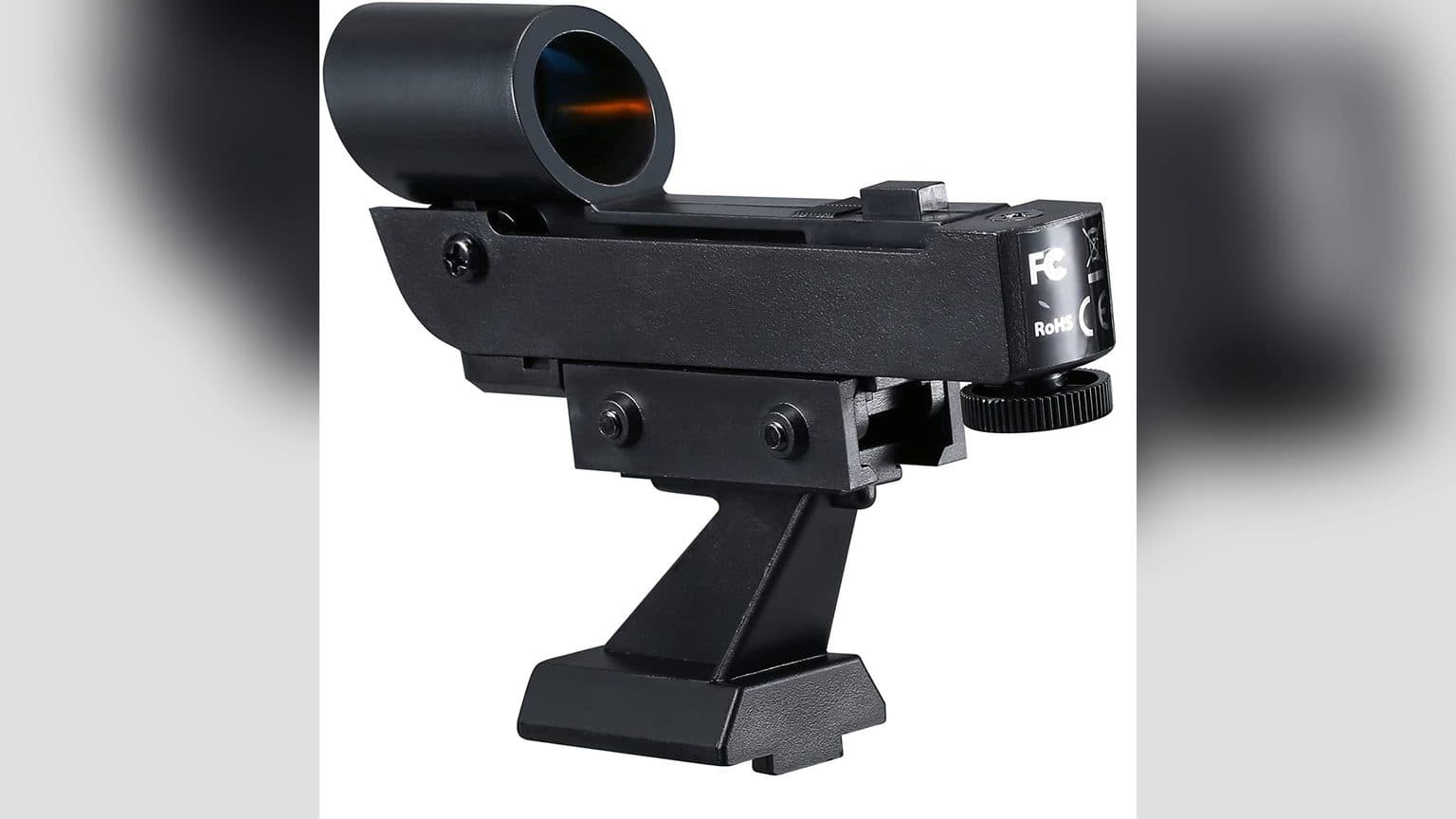 Buscador red dot negro montado sobre telescopio, con punto rojo visible sobre vidrio óptico